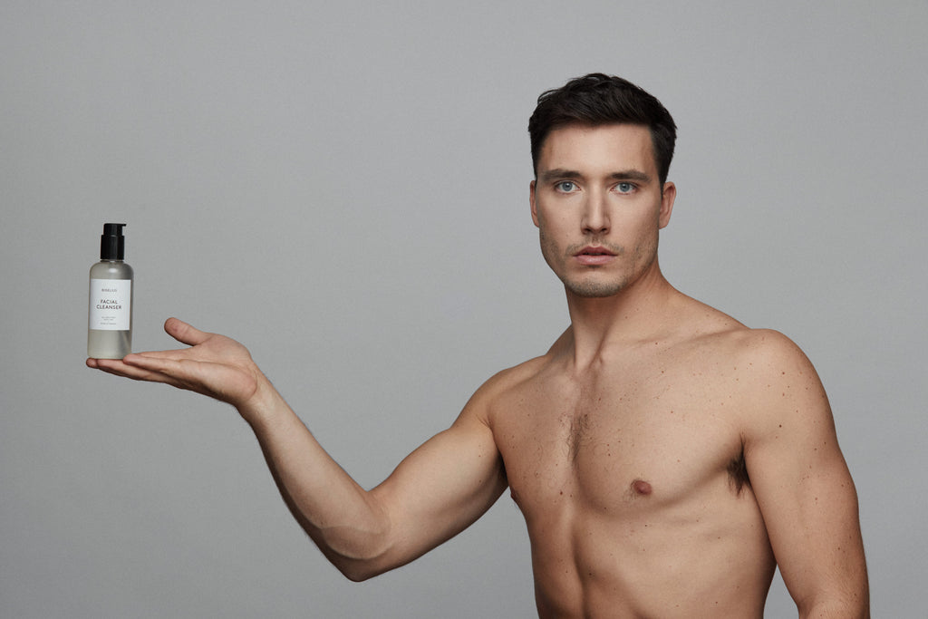 Image showing a male model holding Bigelius facial cleanser